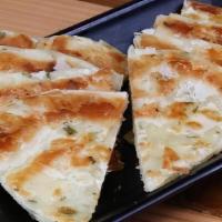 Green Onion Pancake (1) 葱油饼 · Our famous Green Onion Pancake, with freshly chopped scallion flakes and infused oil.