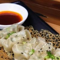 Fried Wonton w/ Chili Sauce (6) 香煎红油大馄饨 · Fried wontons with chicken & veggie filling. One that is crunchy and chewy on the outside, w...