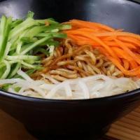 Zha Jiang Mian 京味炸酱面 · Freshly boiled noodles covered with special stir fried sauce, topped with fresh veggie slices.