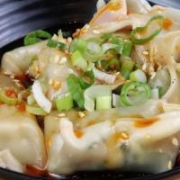 Chicken Veggie Wonton w/ Chili Sauce 红油菜肉大馄饨 · Chicken wonton soaked in our house special chili sauce.