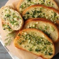 Garlic Bread  · Toasted bread topped with garlic pesto and mozzarella cheese.