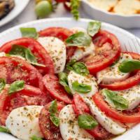 Caprese Salad · Roma tomatoes, Kalamata olives, buffalo mozzarella, fresh basil, balsamic vinaigrette, salt,...