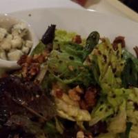 Reigna Salad · Baby greens, walnuts, Gorgonzola, honey Dijon.