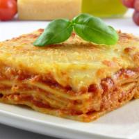 Lasagna Al Forno · Made with ground beef, onions, basil, garlic, tomato base, and meat sauce topped with bécham...