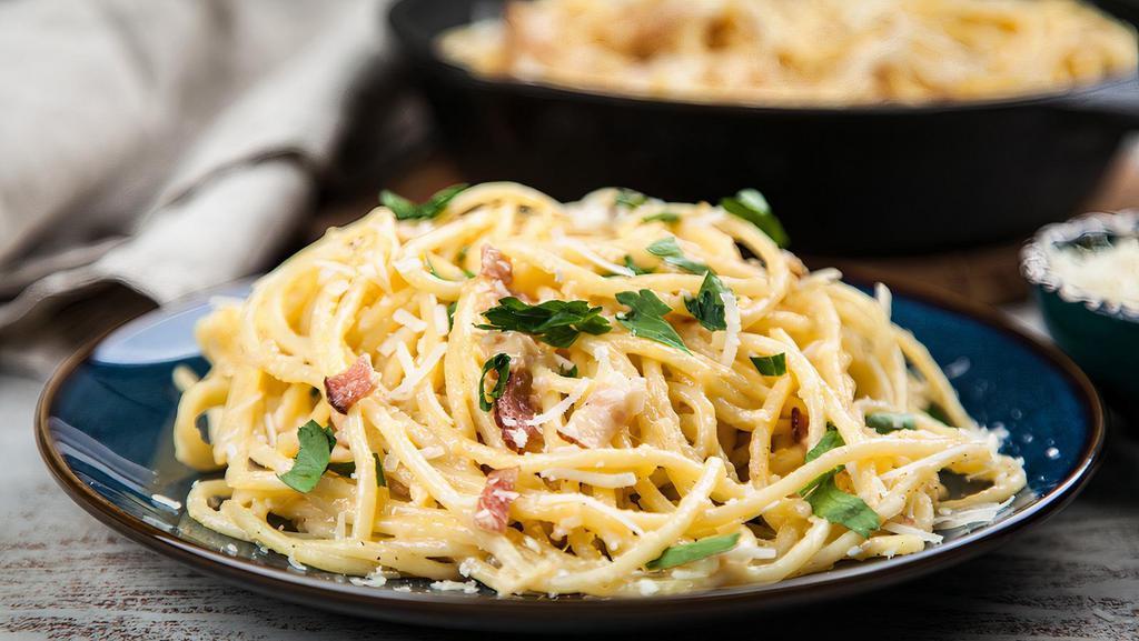 Spaghetti Carbonara · Beef bacon, garlic, egg yolk, salt and pepper in a creamy sauce.