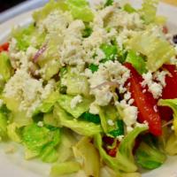 Green Salad · Vegetarian. Leafy greens, tomatoes, cucumbers, onions, feta, vinaigrette dressing.
