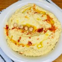 Hummus · Garbanzo beans, tahini, lemon, garlic, pita.