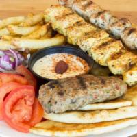 Souvlaki Plate · Three skewers (pork, chicken, bifteki,or kebab) pita, tomatoes, onions, tzatziki, fries.