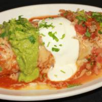 Special Mojado (Wet Burrito) · Any meat, rice, beans, topped with enchilada sauce, melted cheese, guacamole, sour cream, an...