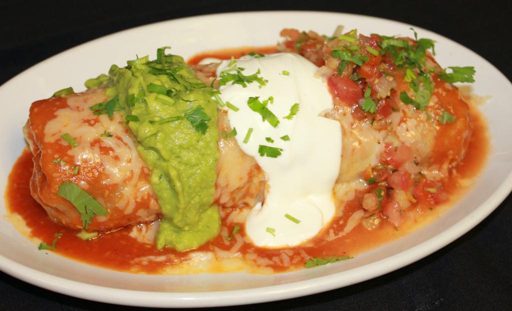 Special Mojado (Wet Burrito) · Any meat, rice, beans, topped with enchilada sauce, melted cheese, guacamole, sour cream, and salsa.