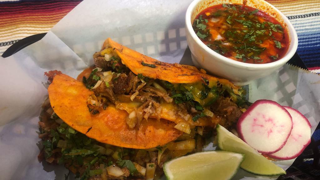 Ribeye Birria Tacos ( 2 tacos) · 2 Tacos, Corn Tortillas dipped in the Birria Broth, grilled cheese, Birria Ribeye steak, topped with onions and Cilantro.
side of 8oz Birria Broth included.