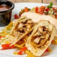 CRISPY FLAUTAS · Four crispy flour tortillas filled with grilled chicken and jack cheese. Topped with cotija ...