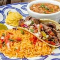 Sizzling Combo · Shrimp sautéed with fajita vegetables and a grilled chicken enchilada with a grilled steak s...
