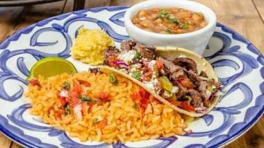 Sizzling Combo · Shrimp sautéed with fajita vegetables and a grilled chicken enchilada with a grilled steak soft taco, frijoles de la olla, rice and warm tortillas.