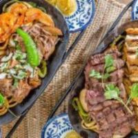 Family Style Fajitas · Steak, large shrimp, chicken and carnitas fajitas served with rice, refried beans, guacamole...