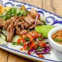 Slow-Roasted Carnitas · Slowly simmered in garlic, oranges and spices, our tender pork is served with fresh avocado,...