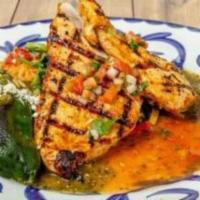 Pollo Fresco En Adobo · Chicken breast marinated with chile de árbol adobo, grilled and served atop sautéed fresh sp...