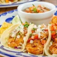 SEAFOOD TACO TRIO · Three grilled or Dos Equis beer battered mahi-mahi or shrimp tacos served with frijoles de l...