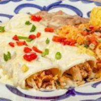 CHICKEN AND SOUR CREAM ENCHILADAS · Tender chicken simmered and smothered in a savory sour cream sauce topped with jack cheese. ...