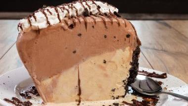 MUDD PIE · A popular dessert brought back!! Our Mudd Pie is made in house with a delicious chocolate cookie crumb crust, layered with premium coffee and chocolate ice cream, topped with chocolate sauce and cinnamon whipped cream.