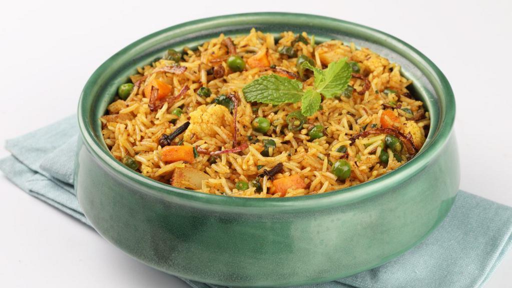 Vegetable Biryani · Rice aromatically flavored with indian spices & fried with mixed vegetables. Gluten free.