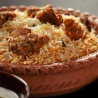 Lamb Biryani · Basmati rice cooked with chunks of lamb, onions, pepper, herbs & spices