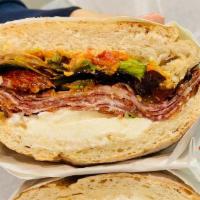 The Calabrese Sandwich · Italian hot coppa, fresh mozzarella cheese, and sundried tomatoes, calabrese spicy spread wi...