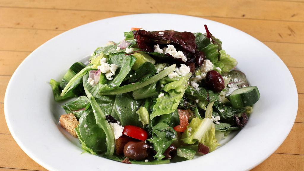 Greek Salad · Organic Mixed Greens, Romaine Hearts, Cucumbers, Tomatoes, Kalamata Olives, Red Onions, Croutons, Grated Carrots, Feta Cheese and Lemon Herb Dressing