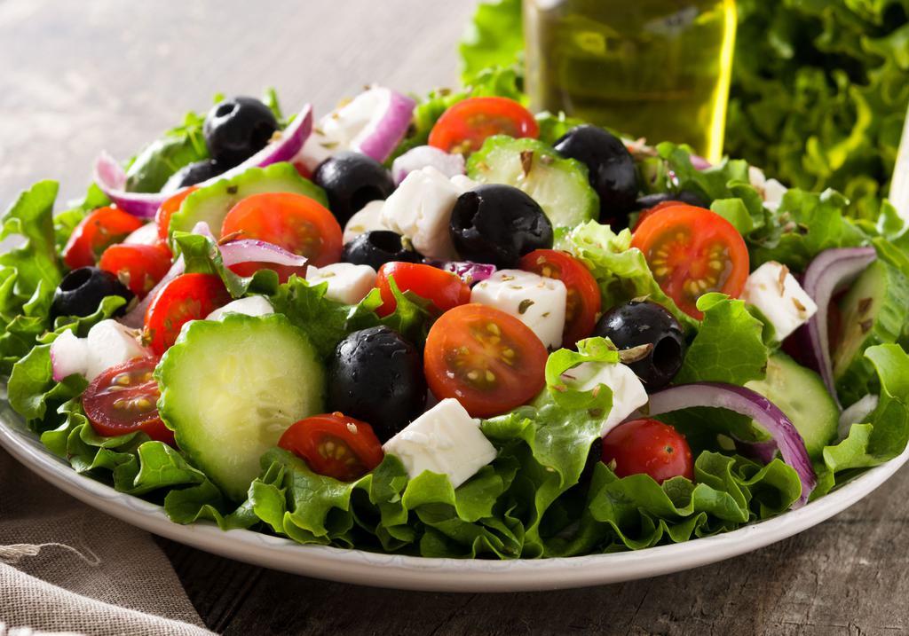 Greek Salad · Romaine hearts, tomatoes, cucumber, red onions, feta cheese, kalamata olives, lemon juice, and olive oil.