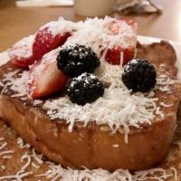 Coconut French Toast · Hawaiian bread dipped in coconut cream batter, topped with mascarpone-jam blend, shredded co...