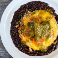 Aztec Huevos Rancheros · House made pulled pork and two eggs layered with corn tortillas, pico de gallo, Mexican chee...