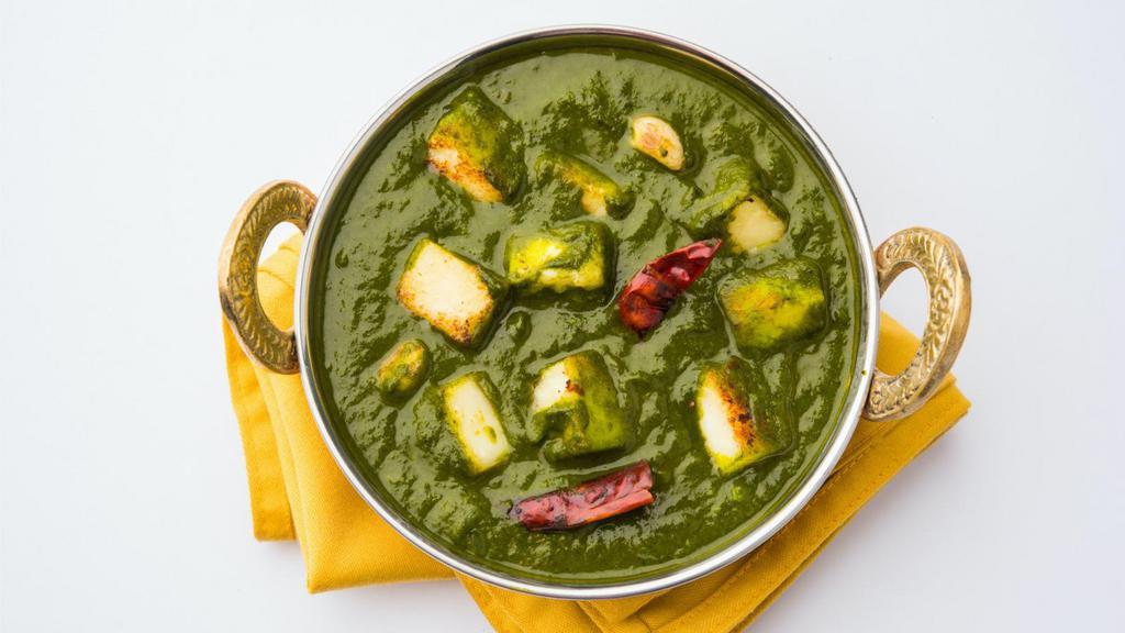 Saag Paneer · Hearty spinach and paneer cheese stew prepared with traditional Indian spices.