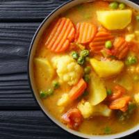 Vegetable Curry · Locally grown vegetables stewed in a traditional curry sauce.