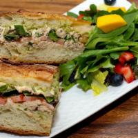 Tuna melt · House-made tuna salad, cheddar cheese, organic mixed greens, fresh sliced tomatoes,
