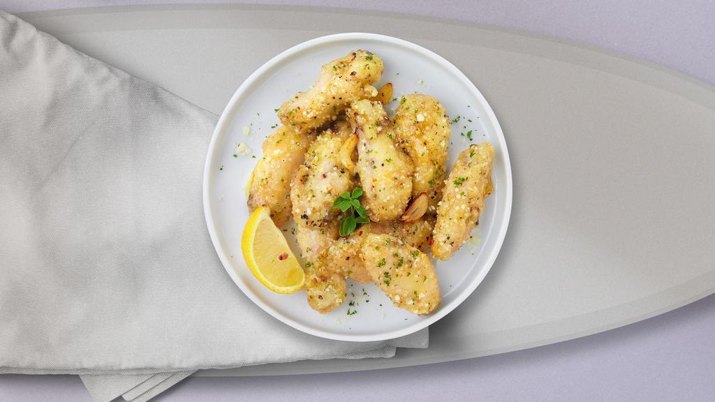 Garlic Gambler Parmesan Wings · Baked to perfection chicken wings, smothered with garlic parmesan seasoning.