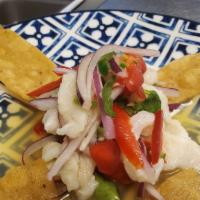 Ceviche de Pescado  · Fish cured in a lime juice, organic red onions, organic English cucumber, red Fresno pepper,...