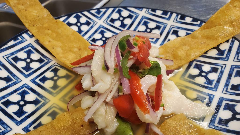 Ceviche de Pescado  · Fish cured in a lime juice, organic red onions, organic English cucumber, red Fresno pepper, organic avocado, 
chile serrano blended, Served with 3 tostadas.