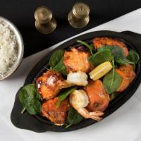 #56. Chicken Tikka · Boneless chicken breast first marinated with special herbs and spices along with yogurt, the...
