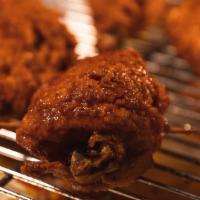Spicy Garlic · Double fried chicken wings coated with sweet spicy garlic sauce in 6 pcs.