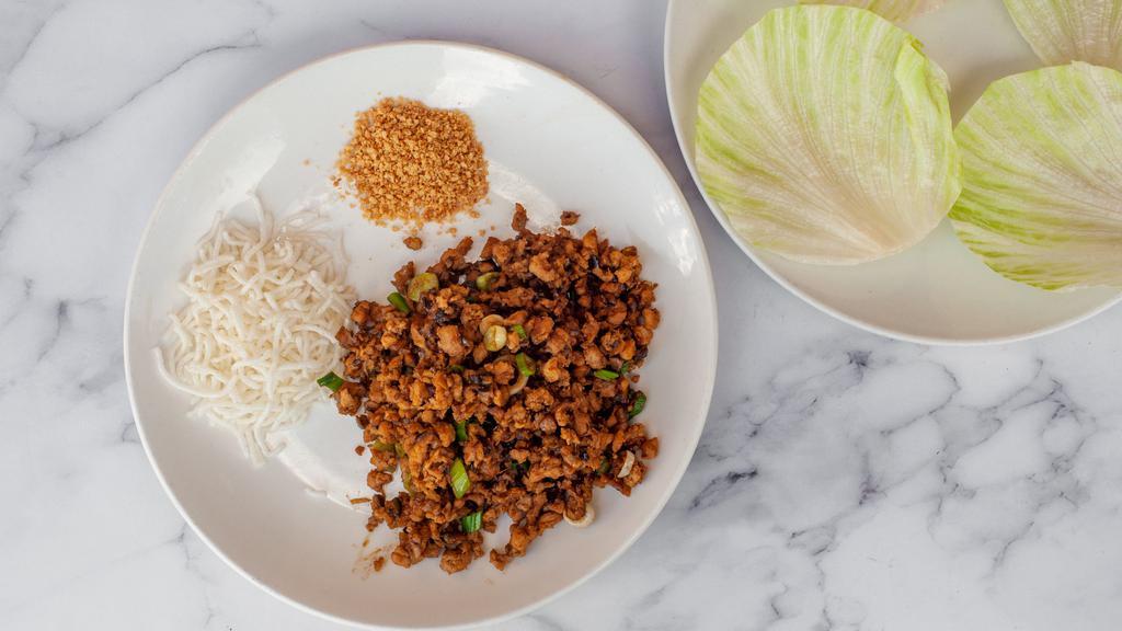 Minced Chicken in Lettuce Cups (4 Lettuce Cups) · Minced chicken stir-fried w/ water chestnuts & black mushrooms in plum sauce w/ crispy rice sticks & crushed peanuts. Served in lettuce cups.