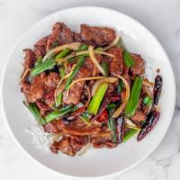 Mongolian Beef · Hot & spicy level 1. House special. Tender sliced beef stir-fried w/ dry pepper & green onio...