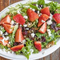 Goat Cheese Salad · Spring mix, goat cheese, toasted walnuts, craisins & seasonal fruit. Served with raspberry v...