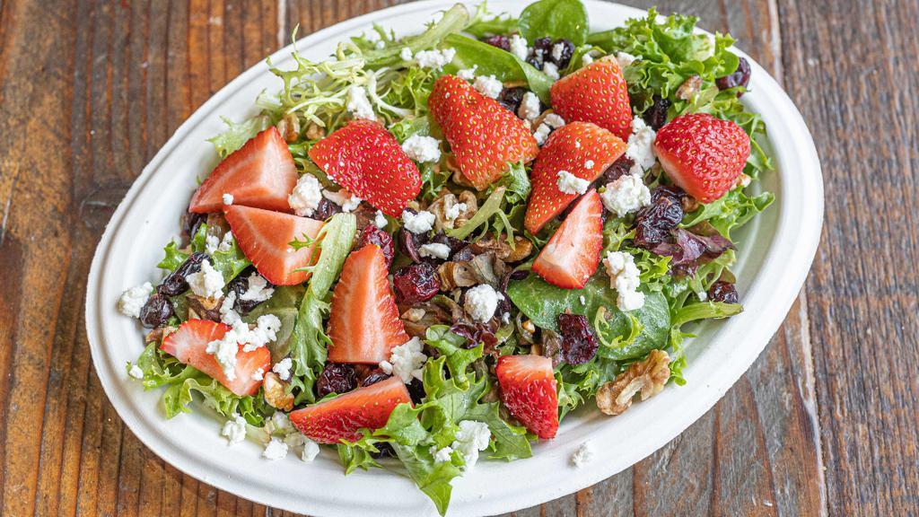 Goat Cheese Salad · Spring mix, goat cheese, toasted walnuts, craisins & seasonal fruit. Served with raspberry vinaigrette.