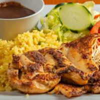 Pollo Asado / Grilled Chicken · Tierno y jugoso filete de pollo a la parrilla sazonado con especias salvadoreñas. / Tender a...