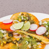 Taco de Vegetales · Seasonal vegetables, served on two corn tortillas with salsa, onion, cilantro, radish and pi...