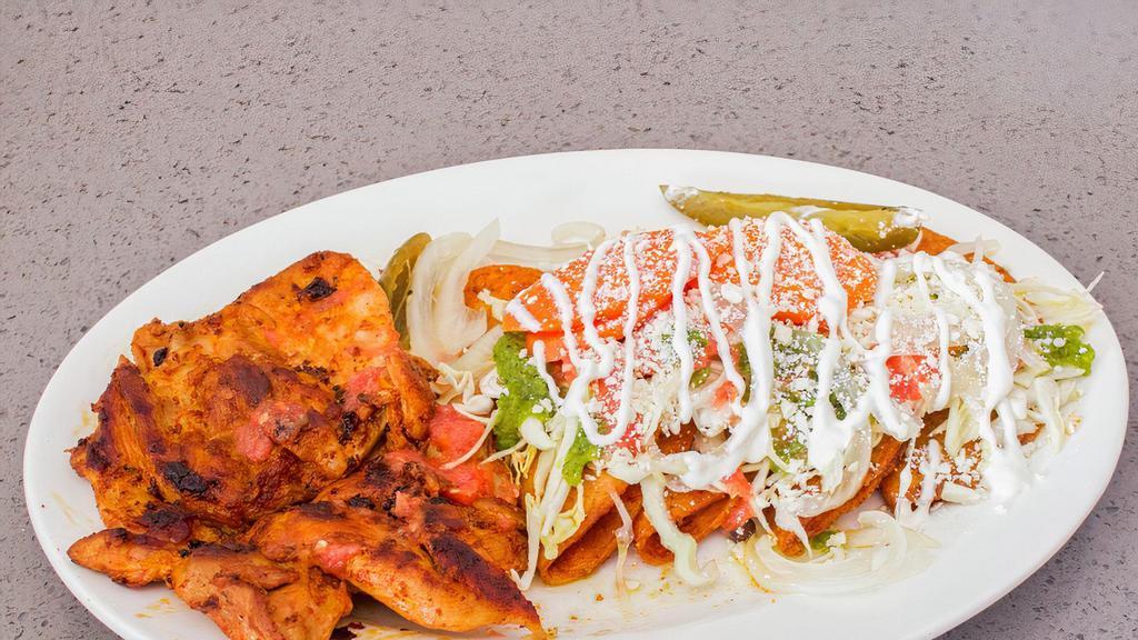 Enchiladas Estilo Michoacan Plate · Four potato filled enchiladas. Topped with cabbage, blended tomato salsa, chile verde, pickled carrots, radish, sour cream, and cotija. Served with a side of grilled chicken.