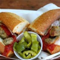 Meatball Sandwich · House made meatballs, melted mozzarella, and tomato sauce. Served with a side of house cured...