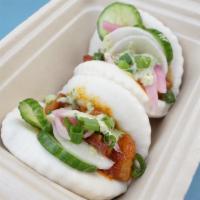 Bellyrub Bao Bao · Our delicious smoked pork belly stuffed inside steamed Bao Buns topped with Cucumber Salad, ...
