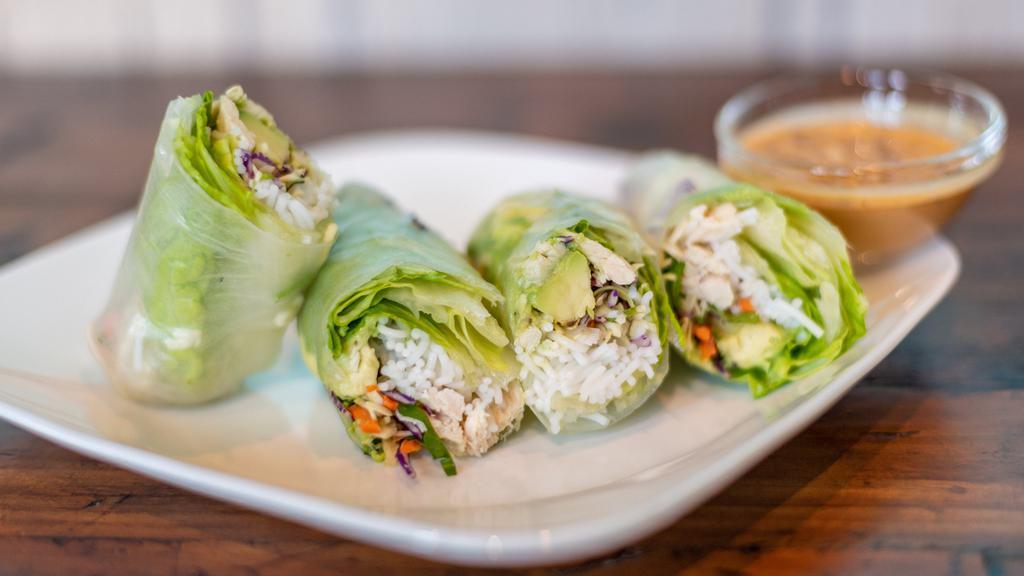 Avocado Spring Rolls · fresh cabbage, Thai basil, cilantro, shredded carrots, serve with roasted peanuts and home made peanut sauce with avocado