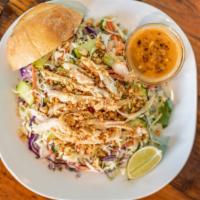 Thai Chicken Salad · Fresh cabbage, Thai basil, cilantro, shredded carrots, served with roasted peanuts and home ...